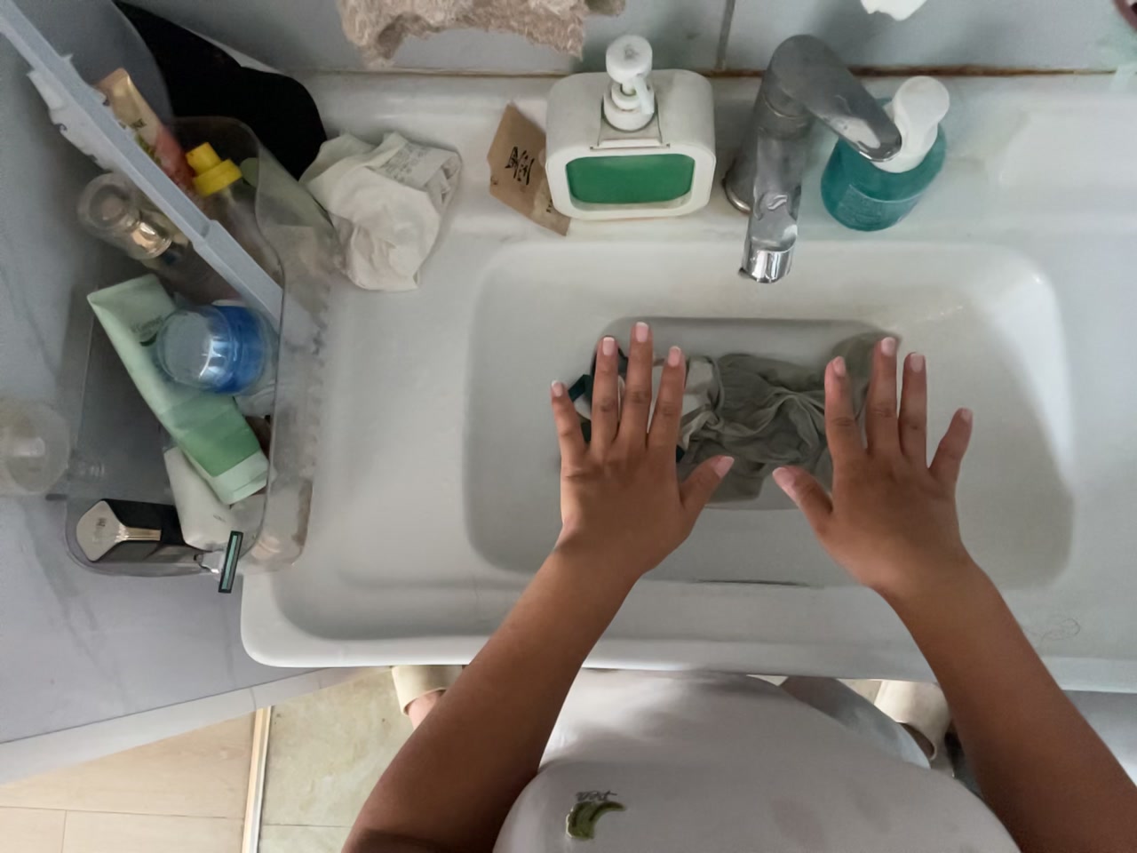 Washing Clothes in a Bathroom first-frame poster