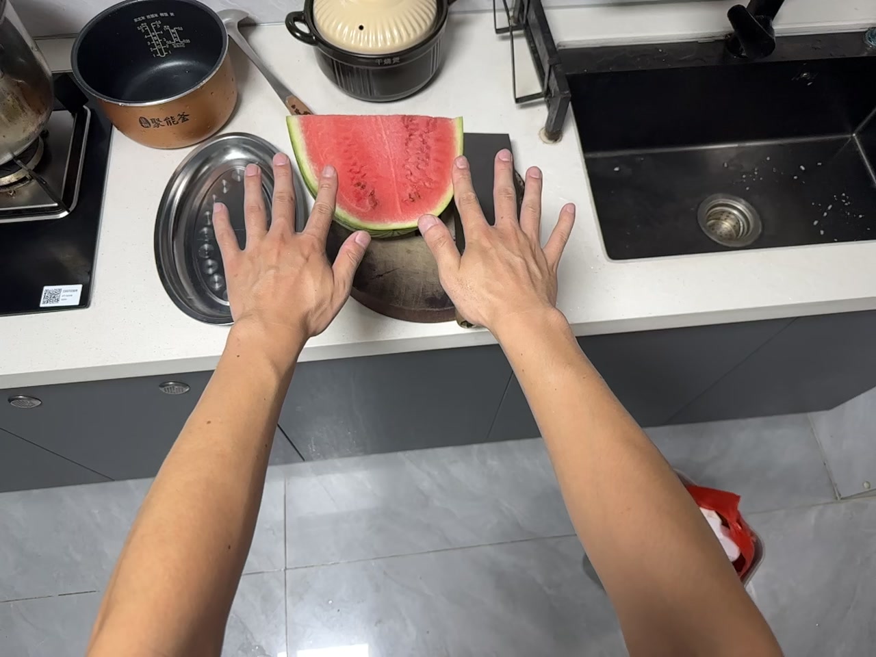 Cutting Watermelon in a Kitchen first-frame poster